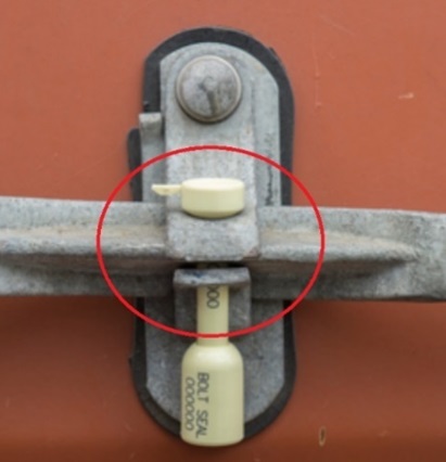obscured markings on shipping container bolt seal